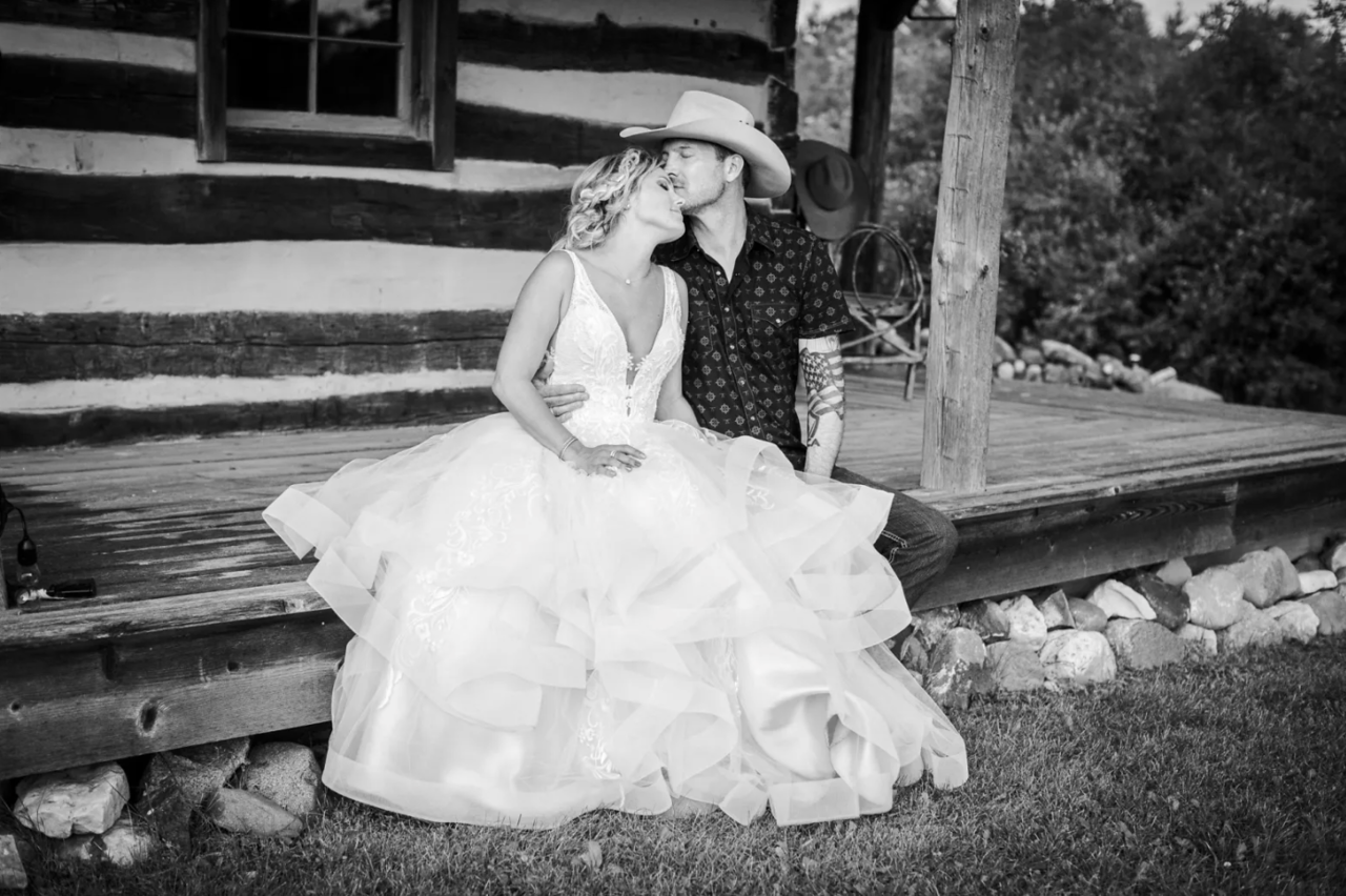 Couple portrait on a log-cabin porch